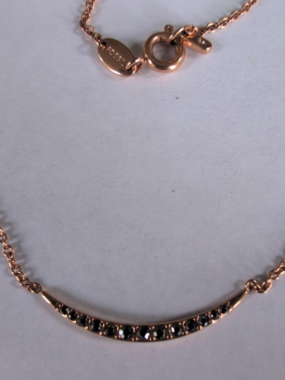 Fossil rose gold adjustable necklace with black rhinestones & diamond like charm